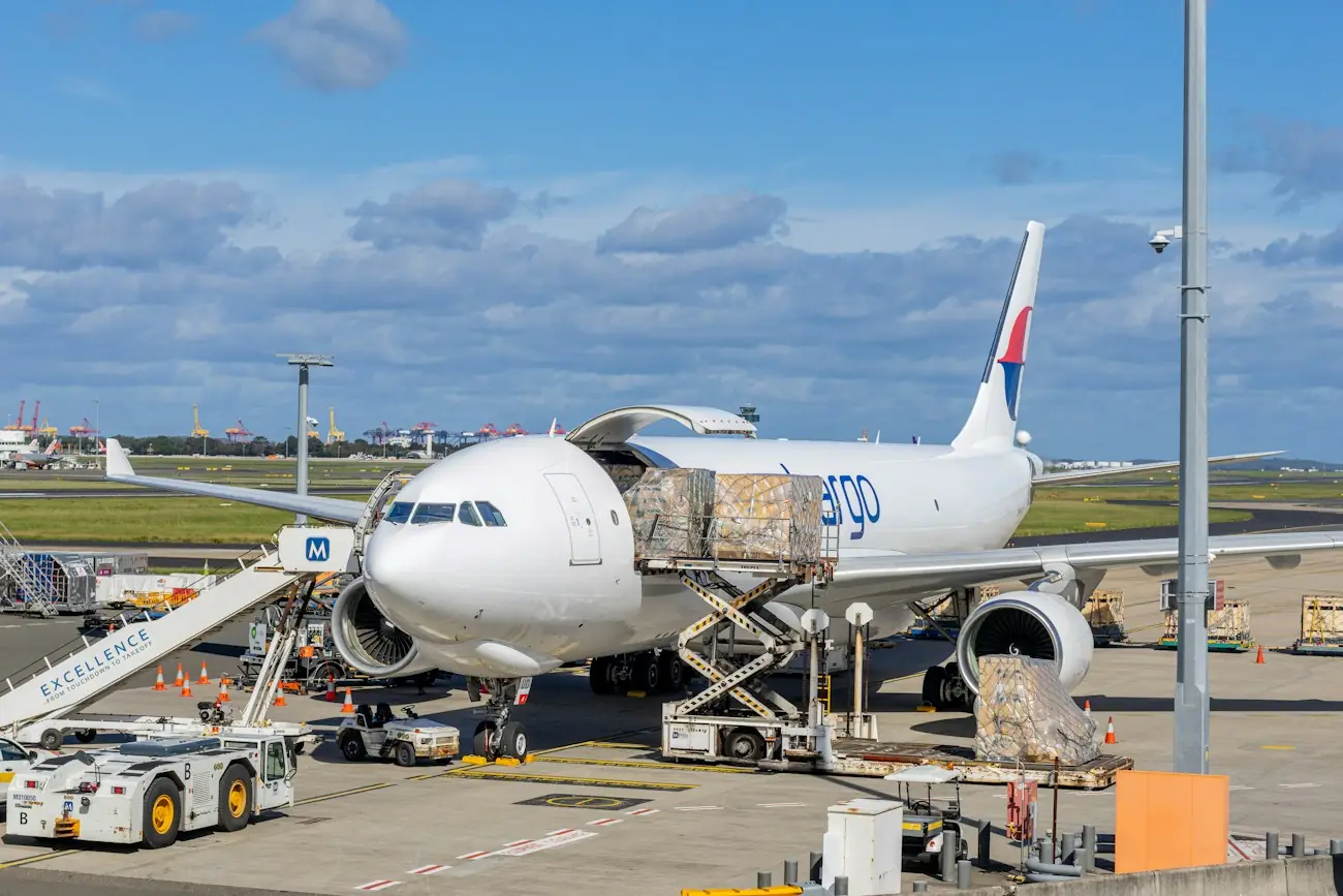 Cargo plane being loaded with freight on an airport apron