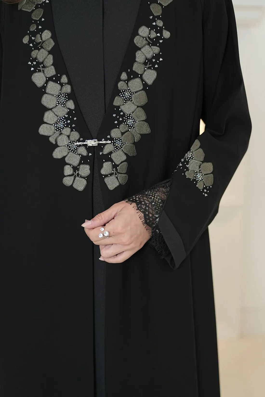 Black abaya with embroidered floral detail down the front