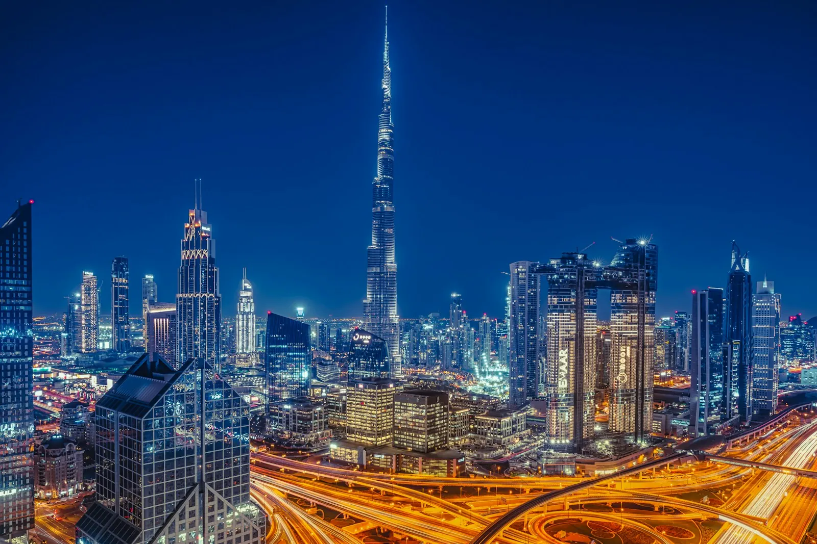 Burj Khalifa above the lit Dubai skyline