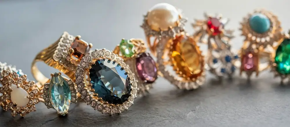 Row of colourful gemstone rings