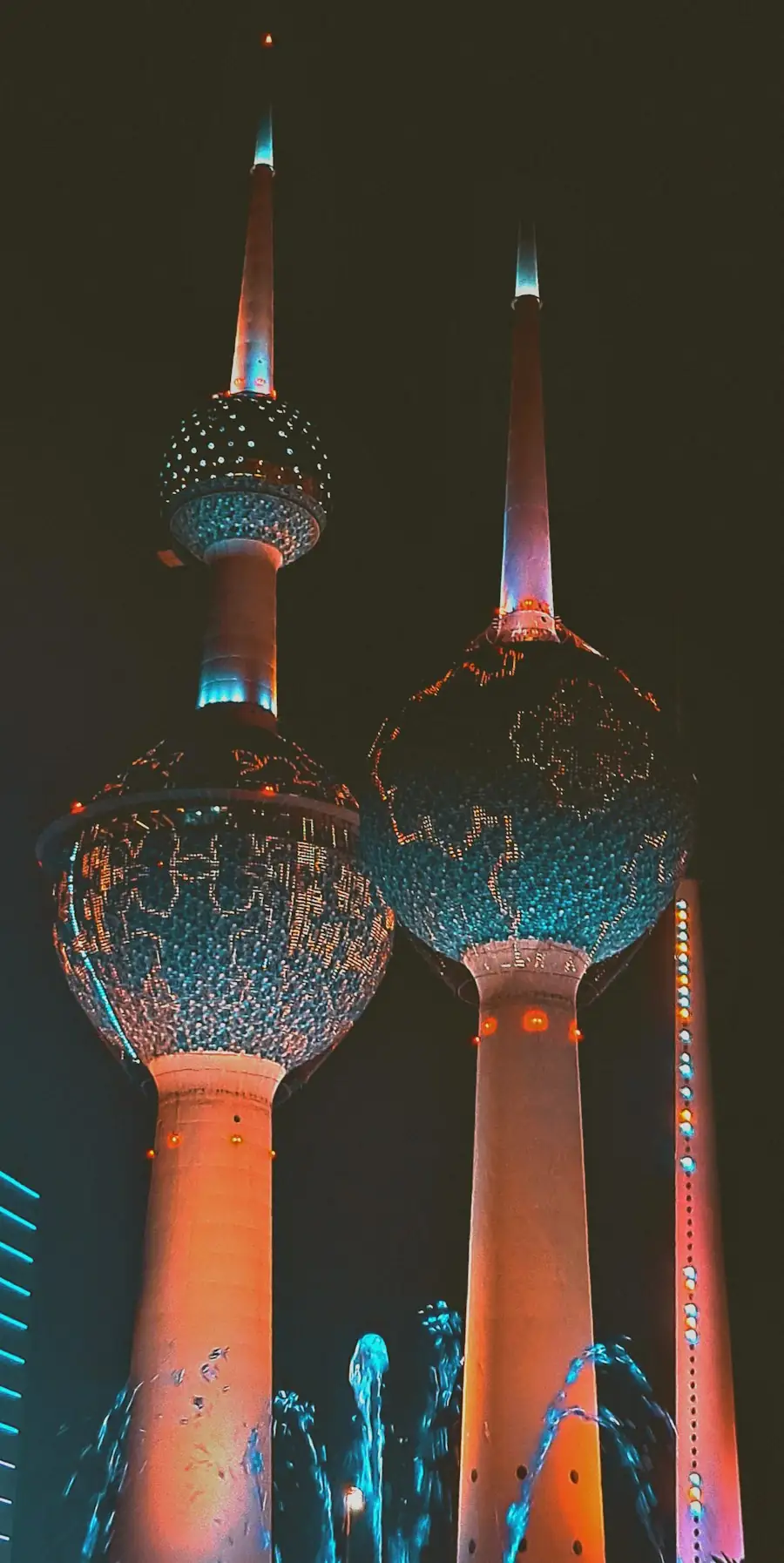 Kuwait Towers lit up at night