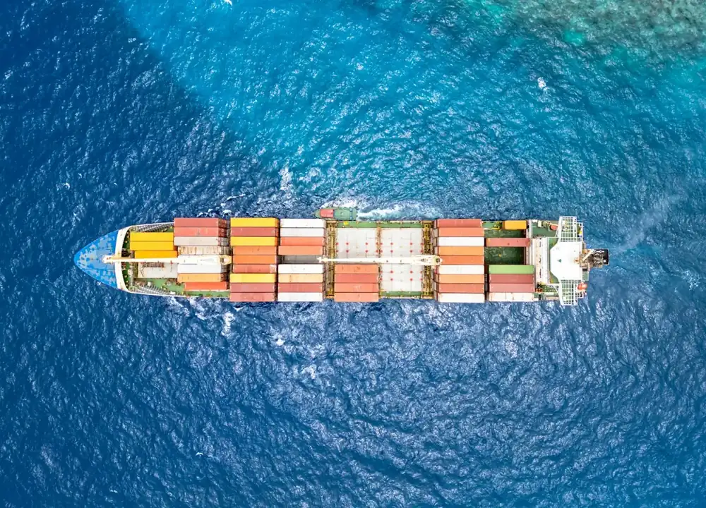 Aerial view of a loaded container ship on open sea