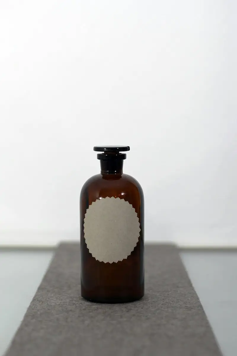 Amber glass apothecary bottle with a blank round label