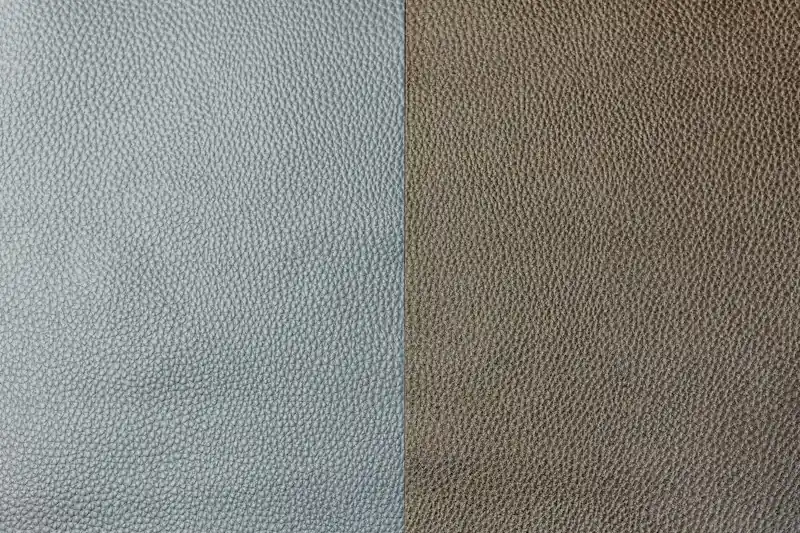 Grey and taupe grained material swatches side by side