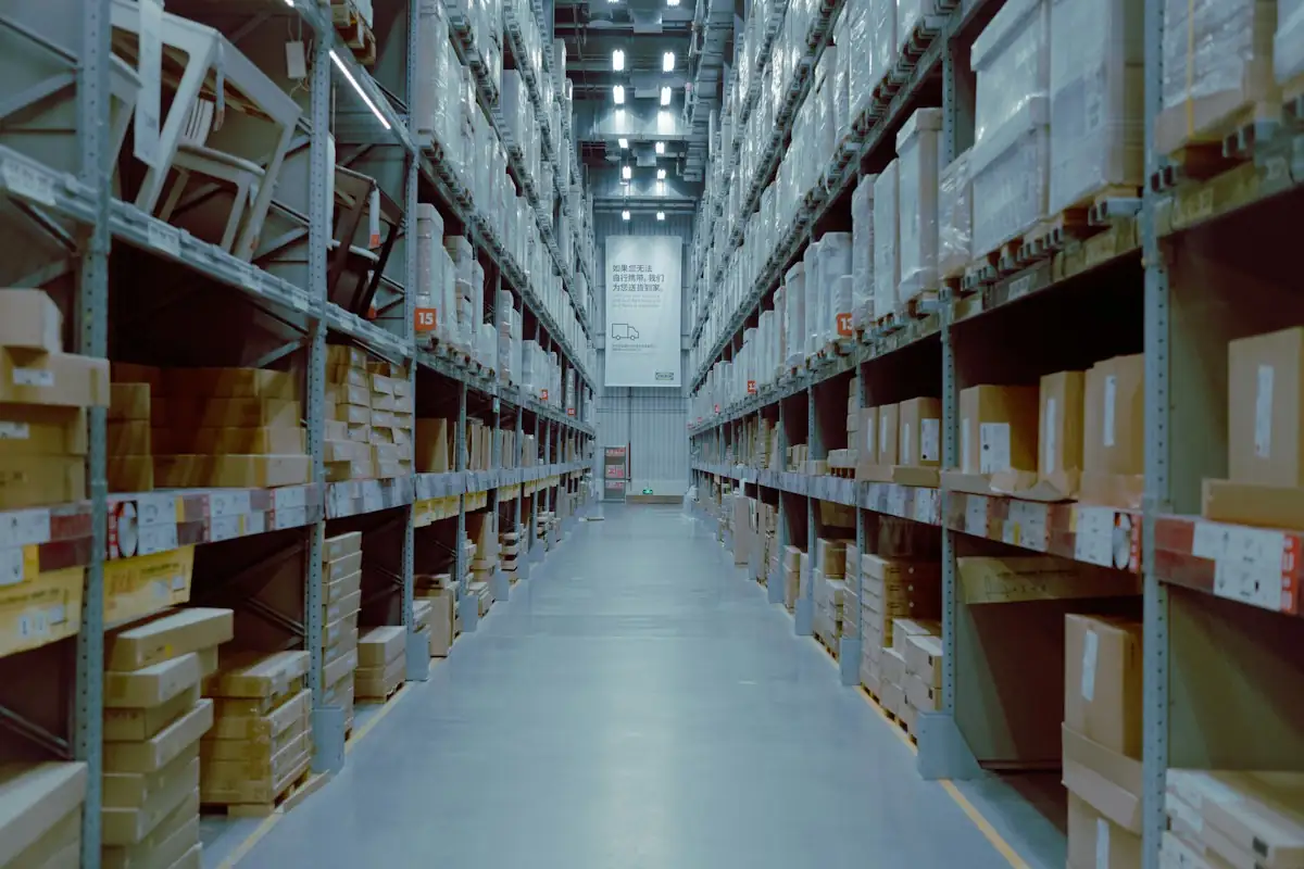 Warehouse aisle with shelves stocked with boxes ready for dispatch